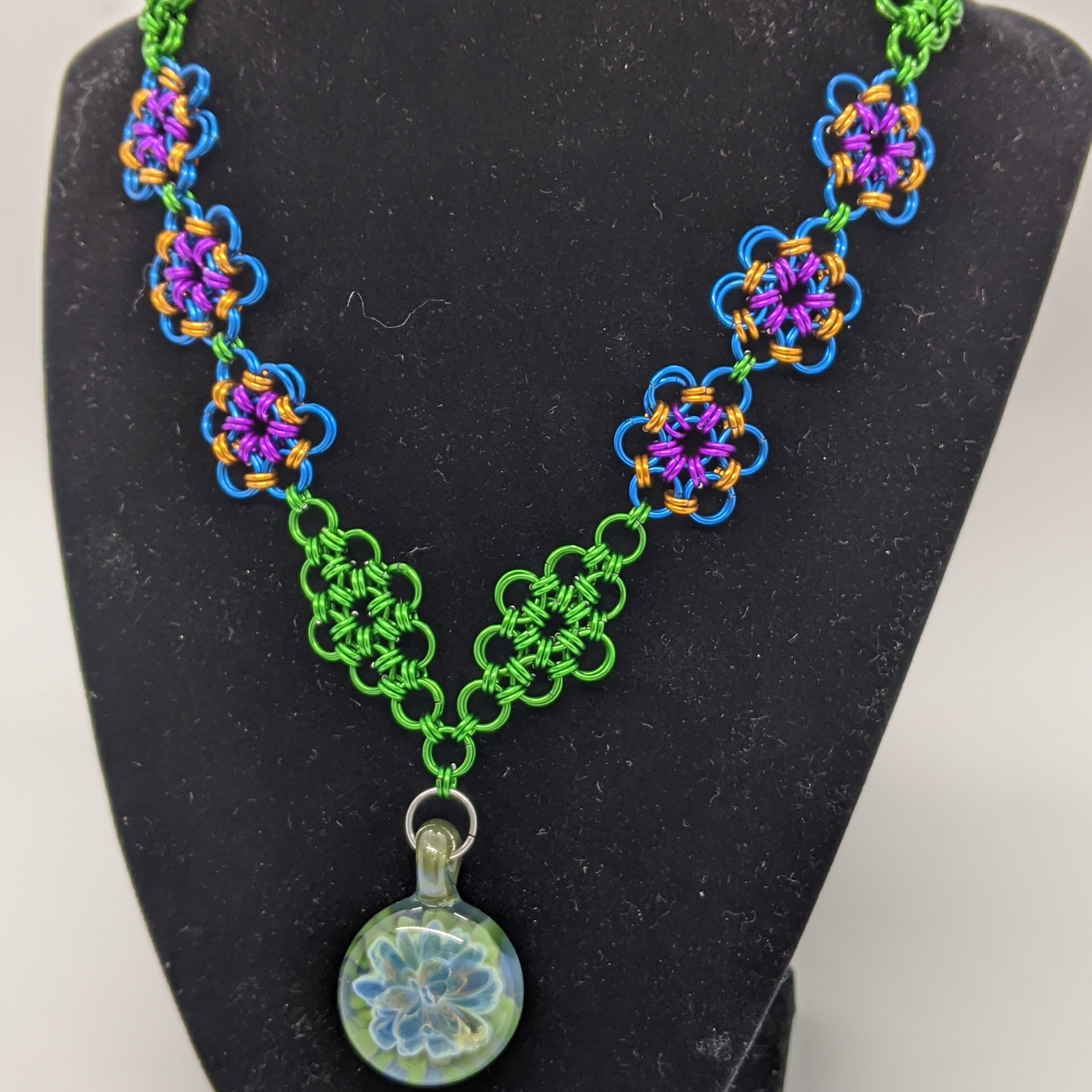floral glass pendant on a chainmaille neckalace