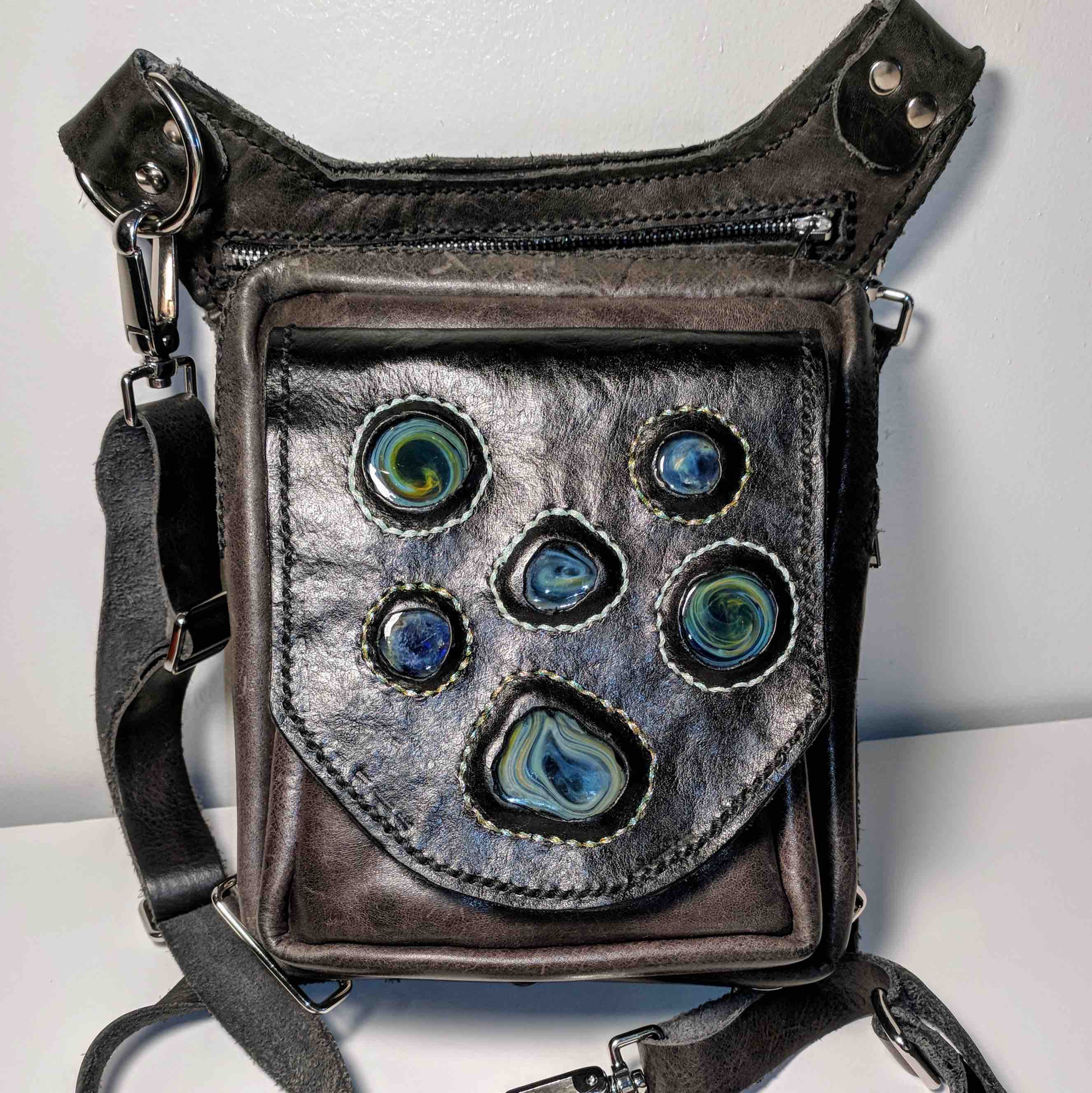 leather purse featuring glass cabachons on the front flap